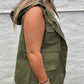 Army green cargo style vest with snap closure and tie waist