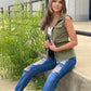 Army green cargo style vest with snap closure and tie waist